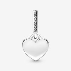 Your jewelry can now be as unique and special as you are with this Engravable Heart Tag Dangle Charm in sterling silver. This heart-shaped tag features an engravable front and back, where you can get the names of your friends, family and loves inscribed. A line of clear cubic zirconia accentuates the top and provides a touch of eye-catching sparkle. It’s easy to create your own unique style with a piece that is easy to personalize – the only limit is your imagination. - Pandora Engravable Heart Tag Dangle Charm - Sterling silver / Cubic Zirconia / Clear Pandora Engraving, Heart Tag, Mesh Bracelet, Clear Stone, Engraved Items, Dangle Charms, Bracelets And Charms, Lab Created Diamonds, Snake Chain