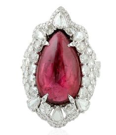 For Sale on 1stDibs - This stunning statement ring has been crafted from 14-karat gold. It is set in 13.65 carats Rubelite and 2.14 carats glimmering diamonds. The ring is a