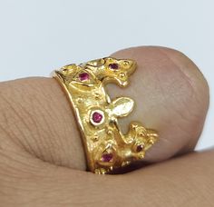 -PRODUCT TYPE - GOLD VERMEIL CROWN RING -MATERIAL - SILVER -PURITY - 18K MICRON - DETAILS OF ONE PIECE -TOTAL WEIGHT - 6.235 GRAMS -SILVER - 6.145 GRAMS -RUBY - 0.45 CARAT NO OF RUBY PIECES - 12 PIECES BAND WIDTH - 5.5 MM 18K Yellow Gold Vermeil Ring: Minimal & Simple, Dainty Handmade Yellow Gold Vermeil Bands. Rustic, Understated Luxury. - Delicate Handmade Yellow gold Vermeil ring. - Made to order, just for you. -Quality is guaranteed. Our mission is always to satisfy our customers with ou Gold Ruby Ring For Jewelry Making, Handmade Gold Ruby Ring For Wedding, Handmade Gold Ruby Open Ring, Unique Gold Ruby Ring For Anniversary, Gold Ruby Ring, 14k Gold, Handmade 14k Gold Ruby Ring, Handmade Heirloom Ruby Ring In Gold, Ruby Crown, Ring Minimal