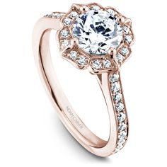 a rose gold engagement ring with an oval center surrounded by small round brilliant cut diamonds