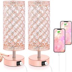 the pink lamp is next to two cell phones