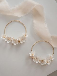 A stunning pair of handcrafted Cherry Blossom floral bridal hoop earrings , with tiny subtle Swarovski crystal stamen centres. Each flower is intricately handcrafted and wired with delicate crystal.  The perfect feminine, statement wedding earrings to complete your bridal look. These bridal earrings are perfect for todays modern bride. Please note earrings are NON refundable. Processing time 3-5 days If you would like your order sooner, please get in touch as I am always happy to accommodate you Floral Gold Jewellery, Wedding Hoop Earrings, Bridal Hoop Earrings, Flower Shaped Hoop Earrings For Wedding, Delicate Flower Charm Hoop Earrings, Gold Flower-shaped Hoop Earrings For Wedding, Elegant Flower-shaped Hoop Earrings For Wedding, Dainty Hoop Earrings With Flower Charm, Elegant Flower Shaped Wedding Hoop Earrings