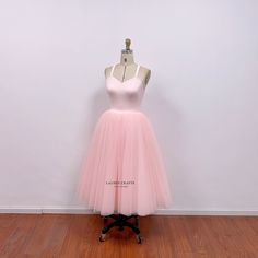 This pearl pink tutu dress is inspired by Carrie sage green tulle dress from iconic 90s TV show. I use crepe fabric to  make the top, and the skirt has 9 layers of tulle fabric, so the skirt is puffy with enough volume. I can custom this Carrie inspired tulle skirt in different colors. This dress can be made to order in custom size. For custom size, please message me your bust/waist/hips measurements and your height. Below are the measurements of standard size 2 to size 12 in inches: Size 2(inches): Bust=32 Waist=25 Hips=35 Height=65 Size 4(inches): Bust=33 Waist=26 Hips=36 Height=65 Size 6(inches): Bust=34 Waist=27 Hips=37 Height=65 Size 8(inches): Bust=35 Waist=28 Hips=38 Height=65  Size 10(inches): Bust=36 Waist=29 Hips=39 Height=65 Size 12(inches): Bust=38 Waist=31 Hips =41 Height=65 Fitted Balletcore Fairy Dress, Fitted Balletcore Fairy Dress For Summer, Pink Tulle Fairy Dress For Prom, Fitted Summer Fairy Dress In Balletcore Style, Pink Fitted Tulle Skirt Dress, Fitted Pink Tulle Dress, Fitted Pink Dress With Tulle Skirt, Summer Fitted Fairy Dress With Tulle Skirt, Sleeveless Balletcore Party Dress