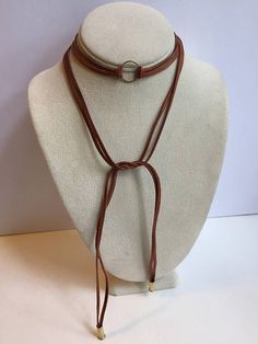 Brown leather wrap choker necklace Trendy Brown Choker Jewelry, Adjustable Brown Lariat Necklaces, Brown Lariat Jewelry With Adjustable Cord, Brown Adjustable Cord Choker Jewelry, Brown Minimalist Jewelry With Adjustable Length, Trendy Adjustable Lariat Choker, Elegant Brown Choker For Festival, Adjustable Brown Lariat Necklace For Festivals, Adjustable Brown Lariat Necklace