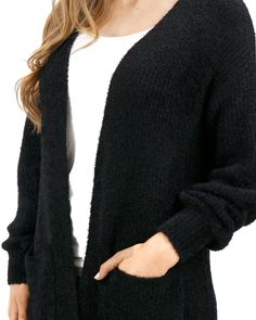 Black Knit Fuzzy Cardigan | Black Fuzzy Cardigan Your closet’s newest favorite cardi! Introducing the oversized Fuzzy Knitted Cardigan - the perfect cardigan that’s anything but basic. With fuzzy textured soft midweight yarn, this cardi gives you an easy layer to style whether you dress it up or down! Why you’ll love it: Oversized black knit cardigan with textured eyelash yarn Soft, cozy feel, with front functional patch pockets and slight lantern sleeve The perfect layering piece to style now a Black Knit Cardigan, Perfect Cardigan, Grace And Lace, Eyelash Yarn, Fuzzy Cardigan, Textured Cardigan, Cardigan Sweater Dress, Cardigan Black, Knitted Cardigan