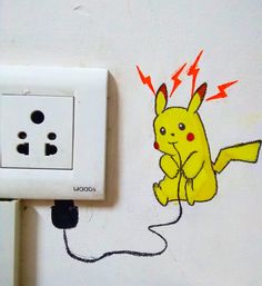 an electrical outlet with a drawing of a pikachu plugged into the wall