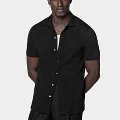 A perfect way to elevate any casual look, this black short-sleeve polo cardigan features a classic polo collar, a seven-button closure, and a slim, tapered silhouette for a sleek aesthetic. Brown Crewneck, Polo Cardigan, Navy Crewneck, Navy Polo Shirt, Sleek Aesthetic, Grey Polo Shirt, Black Polo Shirt, White Polo Shirt, White Crewneck