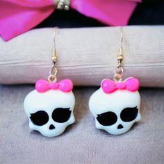 Introducing These Amazing Handcrafted Earrings, Perfect For Your Halloween Costume Or As A Gift For Monster High Fans. The White Skull Shape With Hook Closure And Dangle/Drop Style Makes Them A Unique Addition To Any Jewelry Collection. Made Of High-Quality Acrylic Material, These 1.5" Earrings Are Not Only Durable But Also Feature Cartoon, Tv & Movie Characters Theme. These Earrings Are Perfect For Those Who Love To Accessorize And Stand Out. They Are Handmade With Care And Attention To Detail, Which Makes Them Even More Special. Get These Earrings Now And Add A Touch Of Spooky To Your Look! White Halloween Party Jewelry, Novelty White Earrings For Pierced Ears, White Drop Earrings For Halloween, Fun White Halloween Earrings, Cute White Halloween Earrings, Pink Skull Jewelry For Halloween, Halloween Themed White Earrings, White Kawaii Earrings For Party, White Dangle Jewelry For Halloween