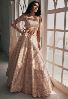 Chamee And Palak-Nandini Dusty Peach Lehenga Set-INDIASPOPUP.COM Pastel Lehenga Designs, Contemporary Lehenga, Pastel Lehenga, Peach Mirror, Peach Lehenga, Leather Applique, Applique Skirt, Dusty Peach, Vacuum Storage