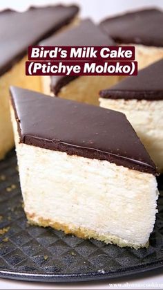 there is a piece of cake that has been cut in half on a plate with the words, bird's milk cake pichye moloko