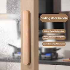 the sliding door handle is made out of wood and has glass on both sides, along with