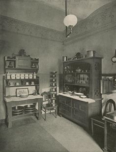 an old fashioned kitchen is shown in black and white