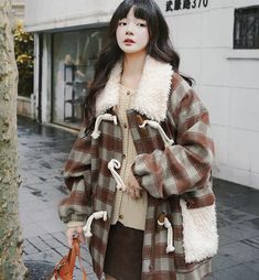 This Women's Horn Button Coat is a must-have for the winter season. Made from a blend of wool and polyester, this coat features a stylish brown plaid pattern that adds a touch of sophistication to your look. The large lapel collar and thick, loose fit ensure both warmth and comfort. Main Features: Made of woolen and polyester fabric Brown plaid pattern for a chic look Oversized coat for easy layering Perfect for streetwear Keeps you warm during the winter months Product Details: Shoulder width: Plaid Wool Outerwear For Cold Weather, Winter Plaid Wool Outerwear, Winter Wool Plaid Outerwear, Plaid Wool Outerwear For Winter, Plaid Wool Coat For Winter, Cozy Plaid Winter Outerwear, Brown Wool Coat For Fall Cold Weather, Brown Wool Coat For Cold Weather In Fall, Plaid Long Wool Coat For Fall