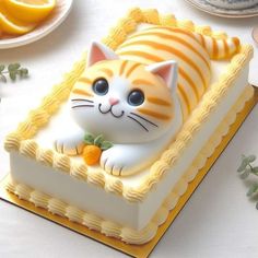 there is a cake with a cat on it and orange slices around the edges,