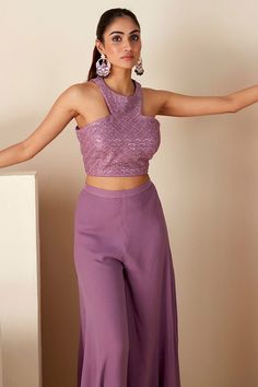 Mauve purple cropped top with sequin and thread embroidery. Paired with a flared pant. - Aza Fashions Party Wear Crop Top For Reception, Festive Purple Palazzo Set For Party, Festive Cropped Tops For Party, Festive Cropped Top For Parties, Festive Cropped Party Tops, Party Wear Sharara For Party Season, Festive Glamorous Evening Crop Top, Festive Party Crop Top, Purple Georgette Festival Sets