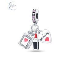 Lipstick & Perfume Bottle Beauty Dangle Charm The beautiful sterling silver charms hang from a heart and pink crystal ring. The 3 charms include a silver heart inscribed with 'beauty', a red lipstick and a stunning perfume bottle surrounded in sparkling cubic zirconia.Suitable for all European style bracelets such as Pandora and can also been worn on your favourite necklace. 925 Sterling Silver Cubic Zirconia Crystal Enamel You will receive your charm in a protective jewellery pouch and polishin Elegant Pink Heart Charms, Silver Charm Necklaces For Valentine's Day With Dangling Charms, Elegant Pink Charms For Mother's Day, Elegant Pink Heart Charm, Elegant Dangling Charms For Mother's Day, Elegant Dangle Charms For Valentine's Day, Elegant Valentine's Day Dangle Charms, Valentine's Day Silver Dangle Charms, Pink Charms For Valentine's Day Anniversary