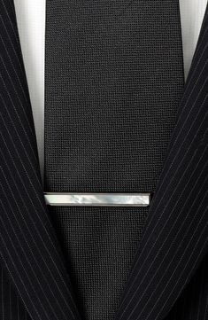 This polished gunmetal tie clip is adorned by a luminous mother-of-pearl inlay for subtly sophisitcated look. 1/4" x 2" Gunmetal plate/mother-of-pearl Imported Silver Suit And Tie Accessories For Formal Occasions, Sleek Silver Jewelry For Formal Occasions, Silver Suit And Tie Accessories For Black-tie Events, Modern Gunmetal Jewelry For Formal Occasions, Elegant Gunmetal Jewelry For Formal Occasions, Elegant Silver Suit And Tie Accessories For Black-tie Events, Luxury Evening Lapel Pin, Elegant Black Suit And Tie Accessories For Evening, Classic Silver Lapel Pin For Business