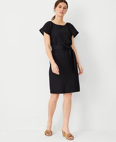 Elevate your wardrobe with the Ann Taylor Linen Blend Boatneck Shift Dress, a testament to understated elegance. This dress is perfect for women who value both style and comfort.

- Size: 00 Regular
- Color: Black
- Gender: Female
- Material: Shell - 55% Linen, 45% Viscose; Lining - 100% Cotton
- Features: Boatneck, shirred short raglan sleeves, self-tie belt, hidden back zipper with hook-and-eye closure, lined body
- Length: 21" from natural waist, hits above the knee
- Care Instructions: Machi Petite Dresses, Tie Belt, Above The Knee, Boat Neck, Flare Dress, Effortless Style, Linen Blend, Shift Dress, The Knee