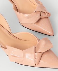 Elevate your ensemble with the Ann Taylor Bow D'Orsay Patent Leather Pumps, a blend of sophistication and comfort. These pumps feature a chic bow-topped d'Orsay silhouette that adds a touch of elegance to any outfit.

- Size: 7
- Color: Camel
- Material: Patent Leather
- Gender: Female
- Heel Height: 2 inches
- Pointy toe design
- Padded footbed for enhanced comfort

Perfect for both office wear and evening events, these pumps are designed to offer comfort without compromising on style. The slee Beige Pointed Toe Heels With Bow, Party Patent Leather Heels With Bow, Formal Bow Patent Leather Heels, Formal Patent Leather Heels With Bow, Feminine Low Heel Patent Leather Heels, Feminine Patent Leather Pointed Toe Heels, Feminine Patent Leather Heels With Pointed Toe, Bow Shoes, Patent Leather Pumps