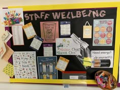 a bulletin board with various items on it and the words staff well being written on it