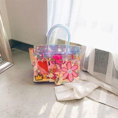 Medium Pink Floral Holographic Satchel Handbags Shoulder Clear Purse for $78.00 | Baginning Multicolor School Bag For Spring, Multicolor Plastic Bags For Daily Use, Trendy Shoulder Bag For Mother's Day, Fun Multicolor Plastic Bags, Multicolor Plastic Beach Bags, Multicolor Summer School Bag, Multicolor School Bag For Summer, Trendy Clear Bag For Spring, Trendy Clear Bags For Spring