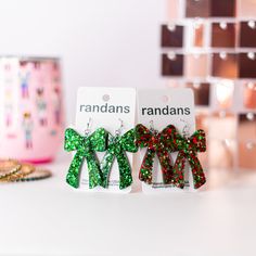 Christmas Glitter Coquette Bow Randans Resin Glitter Earrings Randan resin earrings are the lightest, most comfortable earrings you will every buy! They will quickly become collectors. All hardware is hypoallergenic stainless steel. These earrings are handmade. From the mold making process to the assembly of the earring. Each individual earring is hand poured resin batch mixed with glitter. It is a liquid art. Details Resin earrings Handmade in the USA Hypoallergenic/Stainless Steel hardware Mat Comfortable Earrings, Liquid Art, Resin Glitter, Christmas Glitter, Art Details, Glitter Earrings, Coquette Bow, Glitter Christmas, Resin Earrings