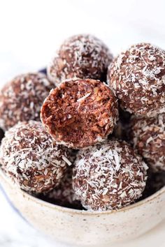 chocolate truffles in a bowl with coconut flakes