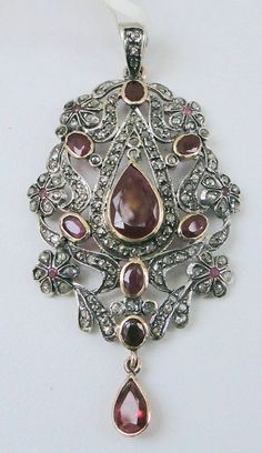 Item-vintage victorian style rose cut diamond and ruby gemstone pendant. total weight-9 grams, weight of rubies-12 carat, old cut flat round diamond weight-3.70 ct, 14 ct gold weight-6.300 gms, size of pendant-6/3.4 cm, Antique Diamond Accent Pendant Necklace, Antique Pendant Necklace With Diamond Accents, Victorian Necklace With 17 Jewels In Oval Pendant, Fine Jewelry Rose Cut Diamond Flower Pendant, Antique Oval Pendant Jewelry With 17 Jewels, Fine Jewelry Flower Pendant With Rose Cut Diamonds, Vintage Pendant Necklace With Diamond Accents, Rose Cut Diamonds Flower Pendant For Anniversary, Antique Diamond Pendant Jewelry