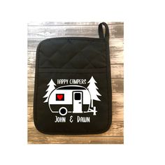 a black bag with the words happy camper on it