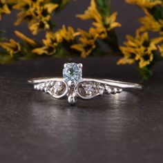 "Womens blue topaz silver ring, Unique small & dainty art deco topaz promise ring for her, Delicate filigree silver promise ring WE OFFER UNLIMITED PERIOD INSTALLMENTS PLAN This is a beautiful, stunning, feminine ring that works well for all occasions, styles, and ages. You will love it! Ring information Main stone: Sky topaz Approximate size: 3.0mm Accent stones: White cubic zirconia Approximate size: 1.5mm (2 stones) Approximate size: 1.25mm (2 stones) Metal type: Silver Metal stamp: 925 S White Topaz Promise Ring With Rose Cut Diamonds, Dainty Diamond Crystal Ring With Accent Stones, Elegant Topaz Ring With Rose Cut Diamonds For Promise, Dainty Crystal Ring With Diamond And Accent Stones, Elegant Sterling Silver Birthstone Ring With Rose Cut Diamonds, Dainty Sapphire Ring With Center Stone, Dainty Silver Diamond Ring With Accent Stones, Elegant Blue Topaz Rings With Rose Cut Diamonds, Light Blue Diamond Promise Ring