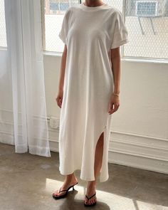 model wearing white short sleeve cotton maxi dress with side slits Oversized Casual Dress For Day Out, Casual Oversized Summer Dresses, Casual Oversized Longline Dress, Casual Dress With Side Slits For Day Out, Casual Dresses With Side Slits For Day Out, Casual Oversized Dress With Side Slits, Relaxed Dresses For Spring Day Out, Relaxed Dresses For Day Out In Spring, Casual Longline Dresses For Spring