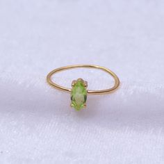 "Materials Gold, Rose gold, White gold Gemstone: Natural Peridot Peridot Ring / 14k Gold Peridot Wedding Ring / Anniversary Ring / Marquise Ring / Stacking Ring / Dainty Ring / Gemstone Ring / Prong set Item Details * Made to Order * Material: 14K Solid Gold (If 18K is needed, please inquire) * Gold Color Choice: Rose Gold, Yellow Gold, White Gold * Total CTW: .50 crt( 4 mm) (varies by size of the ring) * Width of Band: 1.30mm Ready to Ship in 7-10 Business Days * Also available in other gemston Marquise Green Ring In 14k Gold, Yellow Gold Birthstone Crystal Open Ring, Green Marquise Ring In 14k Gold, Yellow Gold Open Ring With Birthstone Gemstone, Dainty Yellow Gold Topaz Gemstone Ring, Green Marquise 14k Gold Ring, Yellow Gold Peridot Diamond Ring With Birthstone, Dainty Yellow Gold Topaz Ring, Gold Crystal Ring For May Birthstone In 14k Gold