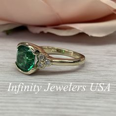 "The ring pictured is lab created emerald and moissanite #6902 Rose Gold is available upon request as a custom order and is a final sale (non refunable, non returnable, non exchangeable). Emerald is the Birthstone for May -Approximate total carat weight: 2.52ctw. diamond equivalent -Center Stone Size: approx. 2.40ct. diamond equivalent -Gem Type: Lab created emerald -Center Stone Shape: cushion cut 8x8mm -Center Stone Color: green, nicest color in emeralds -Center Stone Clarity: VS2 or better -M Heirloom Style Anniversary Moissanite Emerald Ring, Moissanite Emerald Ring With Center Stone For Anniversary, Oval Emerald Diamond Ring With Bezel Setting, Anniversary Moissanite Emerald Ring With Center Stone, Gia Certified Emerald Ring For Anniversary, May Birthstone, Classic Moissanite Emerald Ring For May Birthstone, Moissanite Emerald Ring For Anniversary, May Birthstone, Emerald Moissanite Ring For Anniversary, May Birthstone, Gia Certified Emerald Anniversary Ring May Birthstone