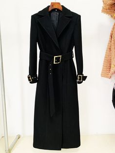 The Long Coat with Gold Belt in the elegant and timeless color of black exudes sophistication and versatility. Crafted from a high-quality, luxurious fabric, this coat combines style with functionality. The rich black hue adds an element of classic refinement, making it a wardrobe staple for various occasions. The coat features a tailored silhouette that complements different body shapes, creating a flattering and polished look. The length extends gracefully, providing both warmth and a graceful Wool Jackets, Patched Denim Jeans, Patch Denim, Button Fashion, Slimmer Belt, Velvet Coat, Gold Belt, Jackets Women, Women Coat