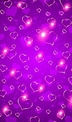 purple hearts with sparkles on a dark background