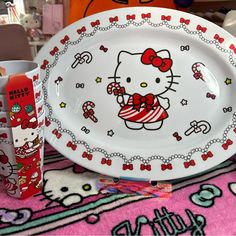 hello kitty plates and cups are on display