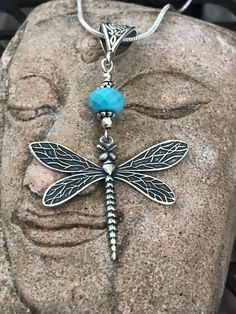 Antique silver dragonfly pendant necklace with chain and your choice of either turquoise or lapis lazuli gemstone. Are you a lover of all things dragonfly? Dragonfly is the bringer of visions of power. Flighty and carefree dragonflies symbolize whirlwind, swiftness and activity. They are also thought to bring good luck. This beautiful dragonfly pendant will definitely bring joy to your life. It's very lightweight and unique. The sterling silver plated dragonfly is hand cast in the United States. Bohemian Butterfly Charm Jewelry For Gift, Nickel-free Adjustable Dragonfly Jewelry, Hypoallergenic Sterling Silver Dragonfly Jewelry, Handmade Silver Dragonfly Jewelry, Dragonfly Shaped Sterling Silver Jewelry Gift, Sterling Silver Dragonfly Jewelry Gift, Nickel-free Sterling Silver Dragonfly Jewelry, Handmade Sterling Silver Dragonfly Jewelry, Nickel-free Blue Dragonfly Jewelry