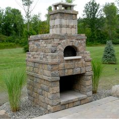 a brick oven sitting in the middle of a park