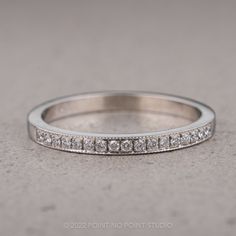 a white gold wedding band with diamonds