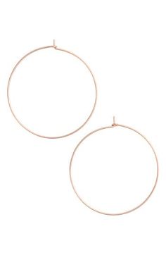 Dress up your everyday look with these delicate hoop earrings featuring a slim silhouette. 1 3/4" diameter Snap-post closure 14k-gold or sterling silver Made in the USA Chic Rose Gold Hoop Earrings For Everyday, Chic Everyday Rose Gold Hoop Earrings, Everyday Rose Gold Hoop Earrings, Chic Rose Gold Round Hoop Earrings, Adjustable Small Hoop Earrings In Rose Gold, Adjustable Rose Gold Hoop Earrings, Nickel-free Rose Gold Hoop Earrings, Dainty Small Hoop Earrings In Rose Gold, Chic Small Hoop Rose Gold Earrings