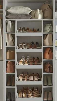 a white closet filled with lots of different types of shoes and purses on shelves