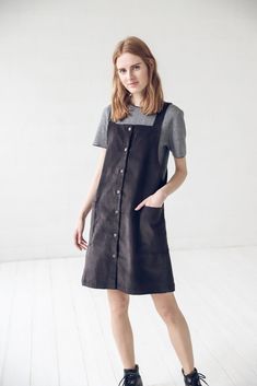 "DETAILS: * With two front pockets and buttons at full dress length * Short small apron dress suitable for all seasons * Made from 100 % cotton * Height of the model is 177 cm (5' 8\") and she is wearing size XS * The full dress length is 93 cm / 36.6'' * Color - black * Available in 2 colors. Please choose another color and size on the right * Product number: D16 CARE LABEL: * machine wash gentle (40 C/104 F) * dry gentle on low heat * wrinkles give the character so there is no need to iron, bu Casual Cotton Apron With Pockets, Sleeveless Cotton Apron With Pockets, Cotton Workwear Apron With Pockets, Cotton Apron With Pockets, Cotton Knee-length Pinafore Dress With Pockets, Brown Cotton Dress With Pockets, Brown Cotton Dresses With Pockets, Black Pinafore Dress, Short Cotton Dress