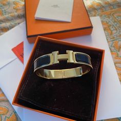 Real Hermes Clic H Bracelet (Black And Gold) Worn 2x, Excellent Condition, Essentially Brand New! Picture Of Receipt (Was A Graduation Gift And Just Don’t Have Any Occasions To Wear It Anymore) Hermes Clic H Bracelet, Hermes Bangle, H Bracelet, Hermes Bracelet, Hermes Jewelry, New Picture, Bracelet Black, Just Don, Black And Gold