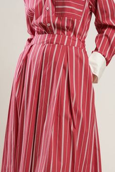 A striped woven full skirt with side zipper closure. Matching Top FT1310. Details: Self : 70% Cotton 27% Nylon 3% SpandexContrast : 100% Polyester Size & Fit - Model is 5`8" And Wearing Size Small- Measurements Taken From Size Small- Approx. Length: 33" Summer Workwear Skirt With Vertical Stripes, Chic Striped Pleated Bottoms, Spring Striped Flared Skirt, Spring Striped Pleated Skirt, Relaxed Striped Skirt For Spring, Chic Striped Lined Skirt Bottoms, Striped Midi Skirt For Work, Striped Long Flowy Skirt, Chic Striped Full Skirt