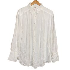 Free Peoplenwt Linen/Rayon Blend Long Sleeve Flowy Oversized White Button Up Blouse Size Small. Excellent Nwt Condition. Flowy Oversized Bodice. Has 2-Sidw Slits, Full Button Up, With Collar. Can Be Woen Opened Un Buttoned Or Buttoned. Perfect For Nightly Walks On The Beach Or A Swim Cover Up. Also Can Be Worn Out On Casual Occasions. Vert Versatile. ***Reasonable Offers Are Definitely Welcome And Will Be Considered Happy Poshing*** Colors May Vary From Different Viewing Devices. Materials: 51% White Long Sleeve Blouse With Button Closure, White Blouse With Back Button Closure For Fall, Oversized Button-up Blouse With Placket, White Button-up Blouse With Back Button Closure, White Button-up Top With Back Button Closure, Oversized White Blouse With Placket, Long Sleeve Linen Blouse With Button Closure, White Linen Blouse With Buttons, White Relaxed Fit Blouse With Placket