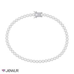 Add a touch of sparkle to any look with this beautiful tennis bracelet showcasing a full band of round premium cubic zirconias. The 2mm bezel-set stones are set continuously across the box-catch closure for a seamless design. This 7" bracelet is available in sterling silver or 18K gold-plated silver and includes a safety latch on the box-catch closure for peace of mind. Diamond White Tennis Bracelet With Bezel Setting, Diamond White Cubic Zirconia Tennis Bracelet With Bezel Setting, White Gold Cubic Zirconia Tennis Bracelet With Bezel Setting, Diamond Tennis Bracelet With Sparkling Stones, Classic Cubic Zirconia Tennis Necklace With Bezel Setting, Cubic Zirconia Jubilee Tennis Bracelet, Classic White Tennis Bracelet With Sparkling Stones, Diamond Bracelet With Sparkling Stones, Silver Cubic Zirconia Tennis Bracelet With Bezel Setting