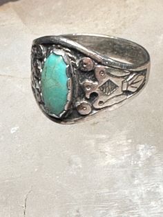 Phoenix ring size 8.75 turquoise Navajo sterling silver women men  Size  8.75 Between a size 8.75 and a size 9 Weight  5.4g  Length 7/8" Width  5/8" Thinnest part Band   3/16" Free Shipping & Free Postal Insurance  Delivered in a Gift Box  If you do not want the ring polished and want to leave the natural patina please let me know at the time of purchase as I do polish rings before I ship rings out. Thanks Free First Class shipping and postal insurance is included. If you want to upgrade to prio Adjustable Engraved Turquoise Ring, Western-style Turquoise Ring With Patina, Antique Silver Turquoise Ring With Patina, Western Silver Turquoise Ring Stamped 925, Western Sterling Silver Turquoise Ring With Patina, Handmade Western Style Silver Turquoise Ring, Handmade Silver Turquoise Ring In Western Style, Southwestern Style Ring With Patina, Adjustable Southwestern Style Ring With Patina