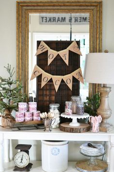 a christmas display on a shelf in front of a mirror with decorations and other items