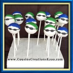 there are many green and blue cake pops