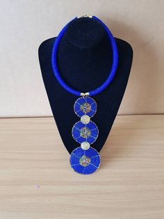 "Beatiful women necklace. Dimensions: 18\" around the neck. Main color: blue Available in different colors.  More necklaces here; https://www.etsy.com/shop/PrimeBeadsKe?ref=seller-platform-mcnav&section_id=33399833 All items are shipped through dhl express!" Blue Beaded Long Crystal Necklace, Handmade Royal Blue Round Beads Jewelry, Long Blue Necklace With Polished Beads, Blue Long Beaded Necklace With Polished Beads, Blue Necklaces With Colorful Round Beads, Blue Necklaces With Large Beads For Gift, Blue Polished Beads Long Necklace, Royal Blue Round Beads Necklace For Gift, Bohemian Blue Beaded Round Necklace